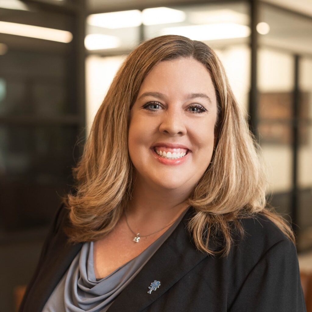 Smiling woman in professional attire in office
