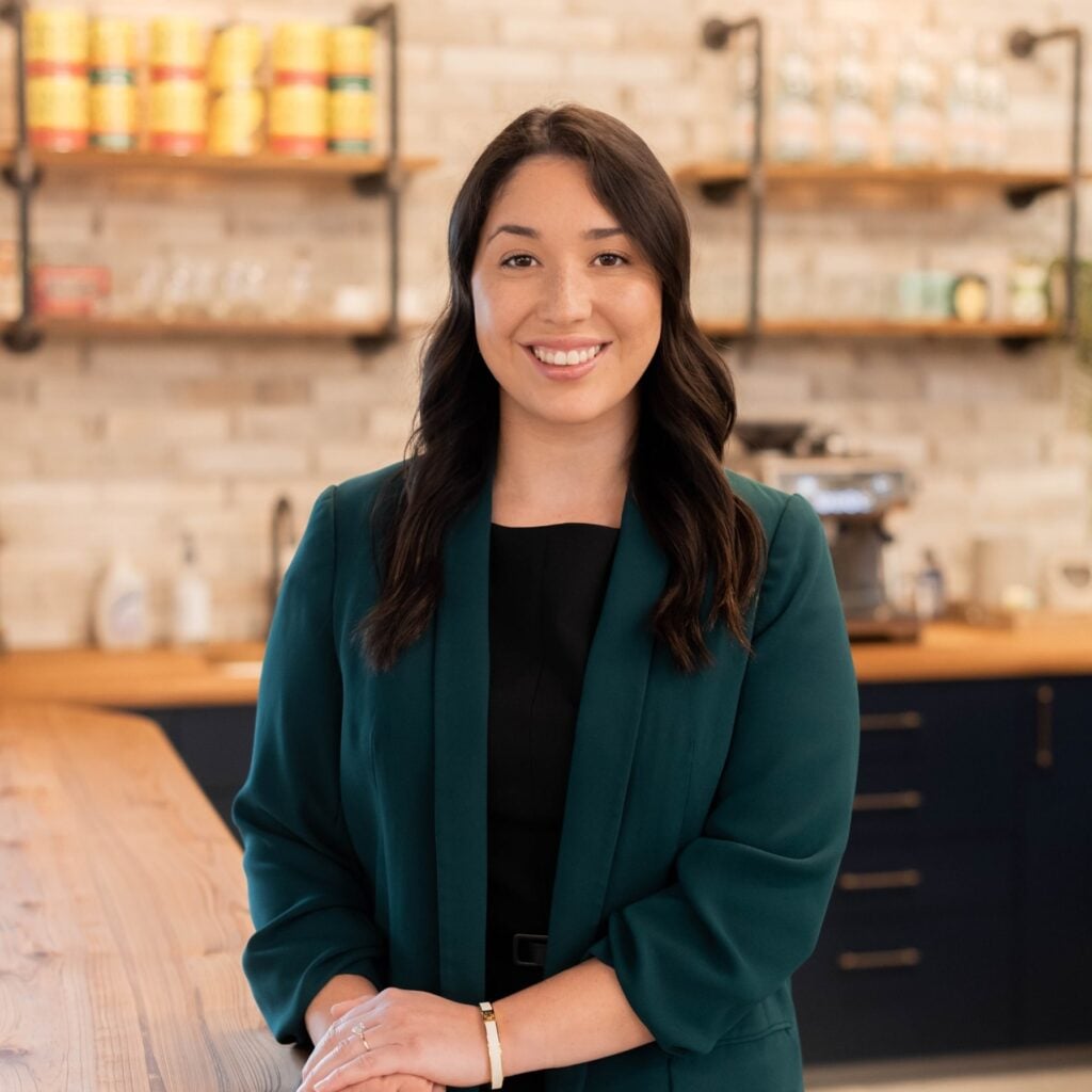 Person smiling in a modern kitchen