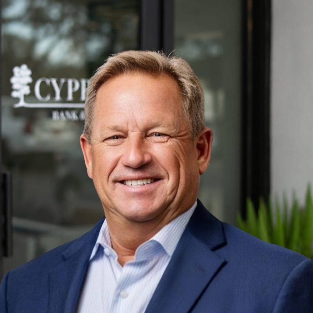Smiling businessman standing outside bank office