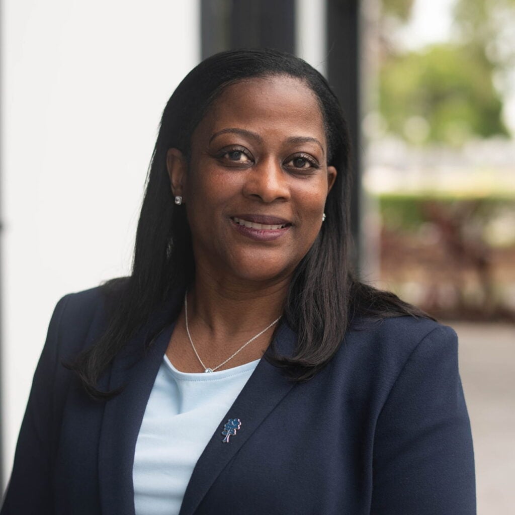 Professional woman smiling in navy blazer