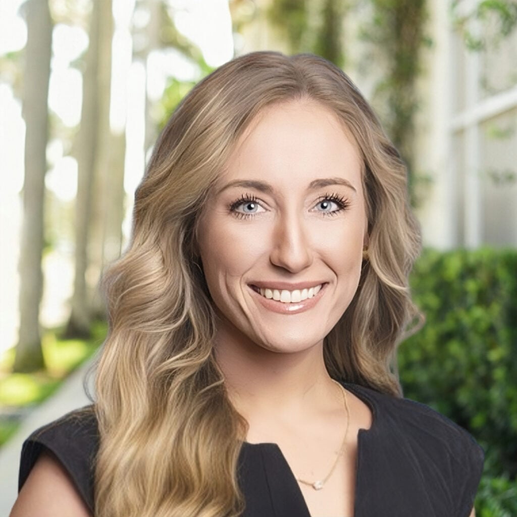 Smiling woman outdoors with greenery background