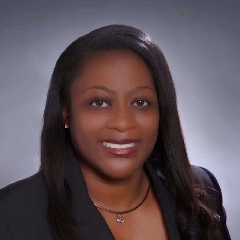 Professional woman smiling in business attire