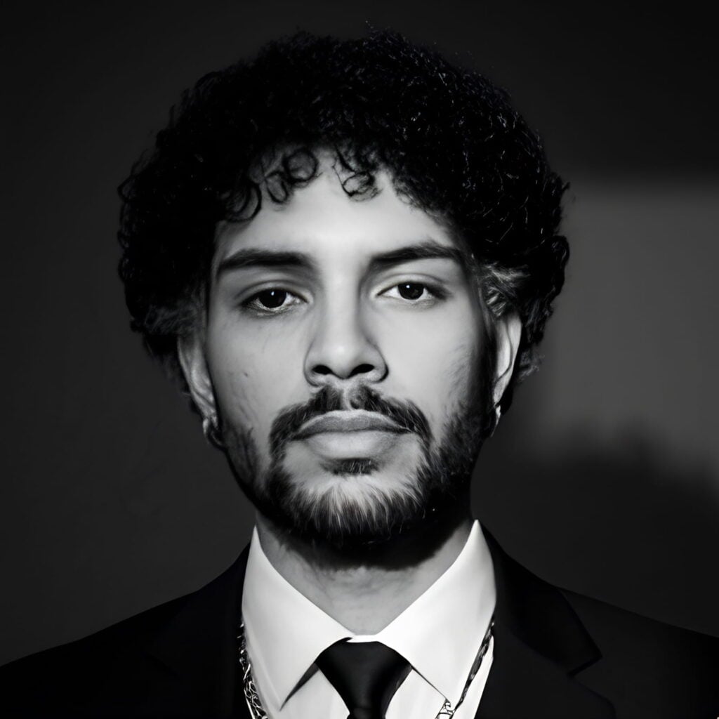 Black-and-white portrait of a bearded man in a suit